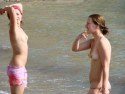 Two amateurs girl topless shot on the beach  34/48