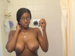 Black amateur girl and her big  tits on selfpics 1/15