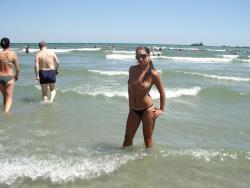 Nice girls on nudist beach 2/44