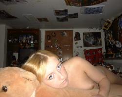 Fantastic young blonde poses and licks on her loll 1/11