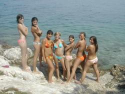 7 girls topless group shot on the beach  8/19