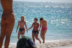 7 girls topless group shot on the beach  12/19