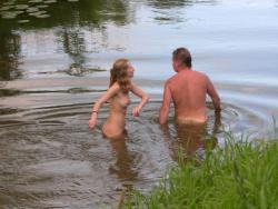 Young nudists and theirs hot summer at the water 15/50