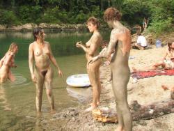 Young nudists and theirs hot summer at the water 41/50