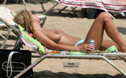 Nudist girls take a drink at the beach  24/79