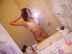 Selfshot pics - cute teen showing tits in bathroom 2/28