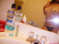 Selfshot pics - cute teen showing tits in bathroom 10/28