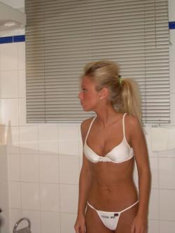 Hot blonde self-shots her small pussy(24 pics)