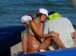 Nudist couple on the beach  10/15