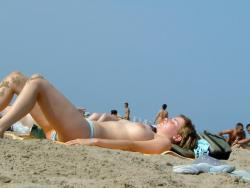 Voyeur on the beach 221/254
