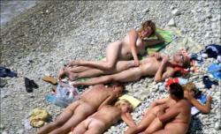 Orgy at a public nude beach 3/10