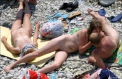 Orgy at a public nude beach 7/10