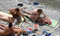 Orgy at a public nude beach 9/10