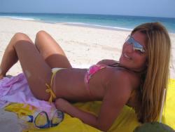 Blonde cutie with hot tanlines at beach 4/36