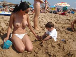 Brunette amateur with big boobs at beach  30/34