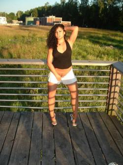 Latina posing outdoors 65/66
