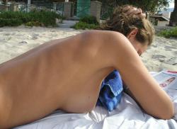 Pretty girl topless at beach  1/33