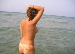 Pretty girl topless at beach  6/33