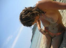 Pretty girl topless at beach  30/33