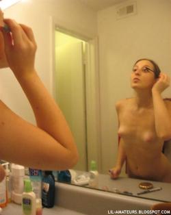 Cute teenie with nice puffy nipples taking a shower  7/37