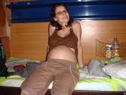 Pregnant milf with glassesposing  21/84