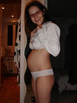 Pregnant milf with glassesposing  72/84