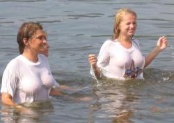 Funny girls on lake in wet shirts 1/33