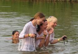 Funny girls on lake in wet shirts 2/33