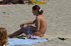 Topless teen getting changed on the beach 9/25