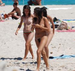 Three hot teens on the nudist beach 1 3/32