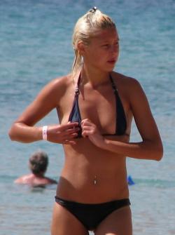 Blond beach girl problems with the bikini 35/47