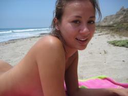Brunette with pierced nipples on nudist beach 3/51