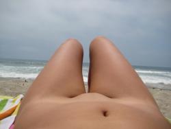 Brunette with pierced nipples on nudist beach 13/51