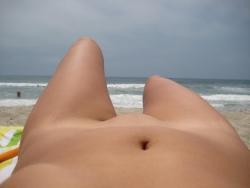 Brunette with pierced nipples on nudist beach 14/51