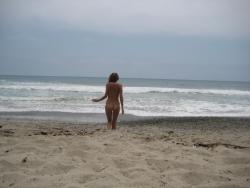 Brunette with pierced nipples on nudist beach 19/51