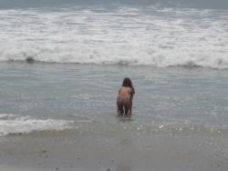Brunette with pierced nipples on nudist beach 22/51