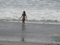 Brunette with pierced nipples on nudist beach 23/51