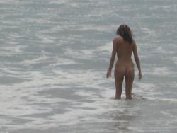 Brunette with pierced nipples on nudist beach 24/51