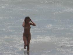 Brunette with pierced nipples on nudist beach 25/51