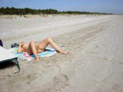 Young brunette girlfriend on the beach 9/10