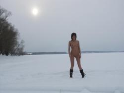 Outdoor naked teen on the snow 60/76