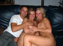 Two girls and one boy make a fun on sofa 3/43