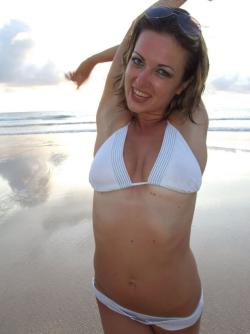 Beauty girl poses on beach 2/12