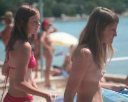 A bunch of girls topless on the beach 7/38