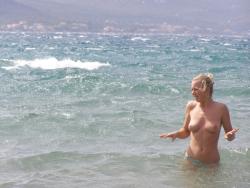 Topless beach vacation photos of hot blonde woman 4/20