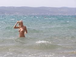 Topless beach vacation photos of hot blonde woman 5/20