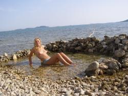 Topless beach vacation photos of hot blonde woman 7/20