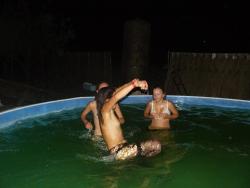 A bunch of teens jump in the pool topless 9/14