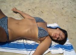 Cute brunette topless on the beach 1/11