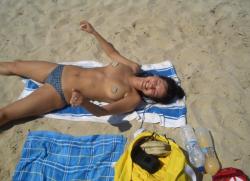 Cute brunette topless on the beach 6/11